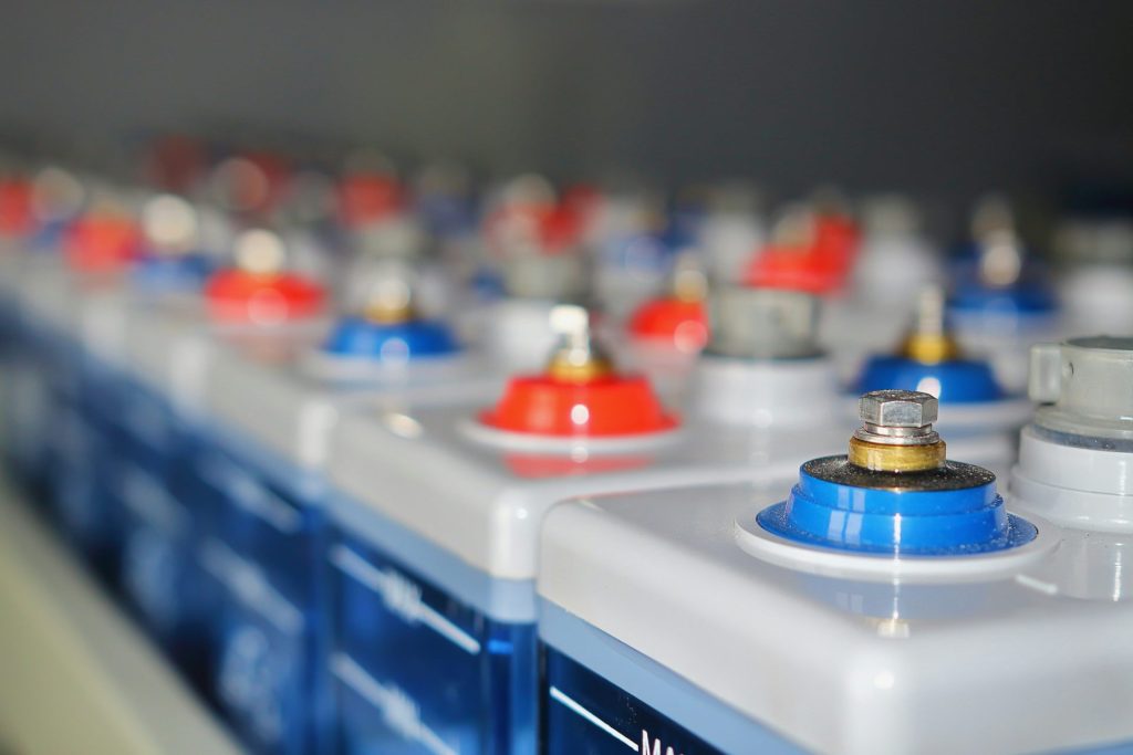 Rows of batteries with red and blue terminals
